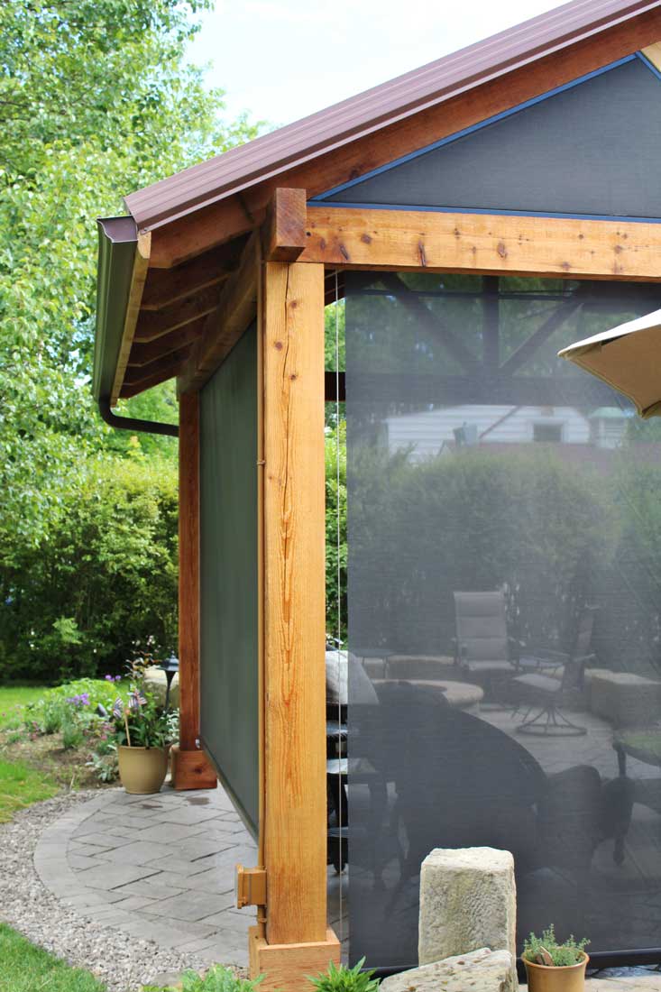 Screening Solutions Ohio transforms this outdoor patio into a screened-in porch in seconds by using Phantom Retractable Screens. The Cable Guided Screen system operates as a sun shade and runs on a cable.