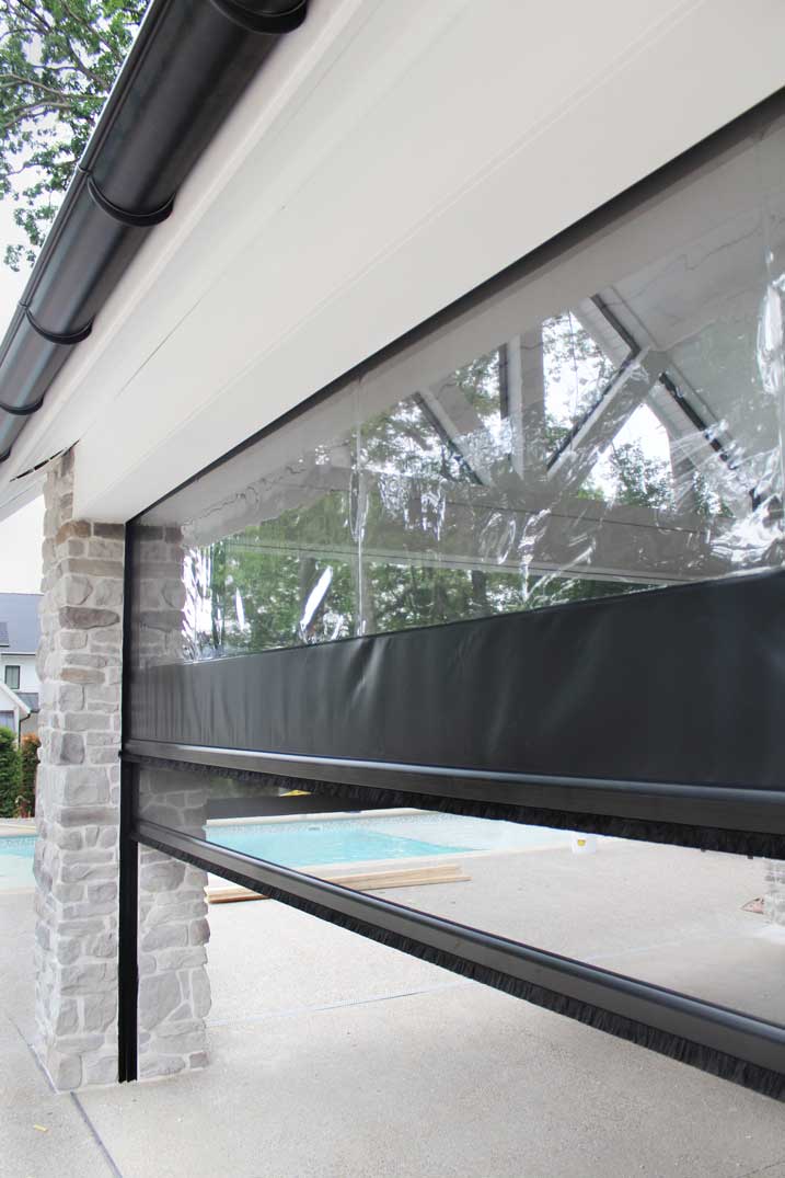 Phantom Screen and Vinyl System on a pool house in Ohio.