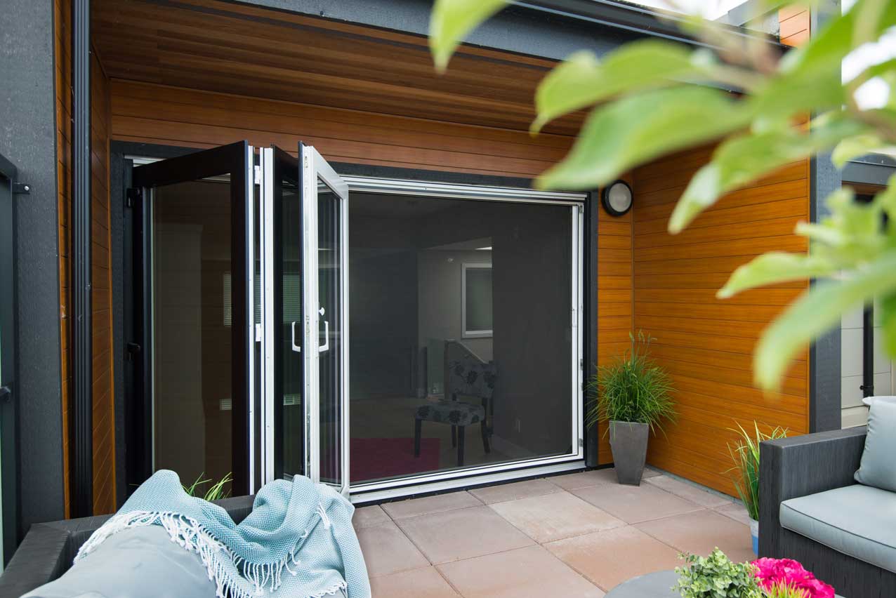 Phantom XL Wall Screen on a bi-fold door on a balcony.