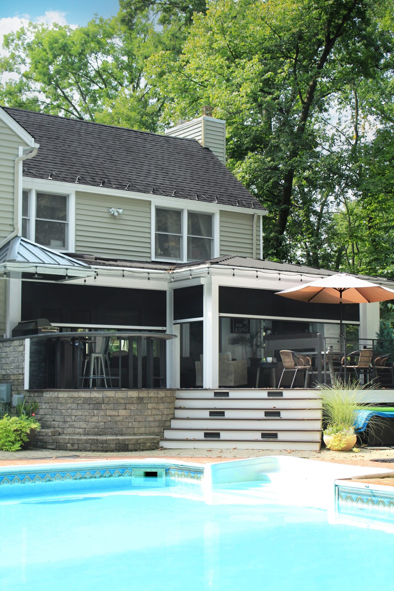 Screening Solutions Ohio transforms this outdoor patio into a screened-in porch in seconds by using Phantom Retractable Screens. These motorized screens appear at the touch of a button and retract out of sight when not in use.