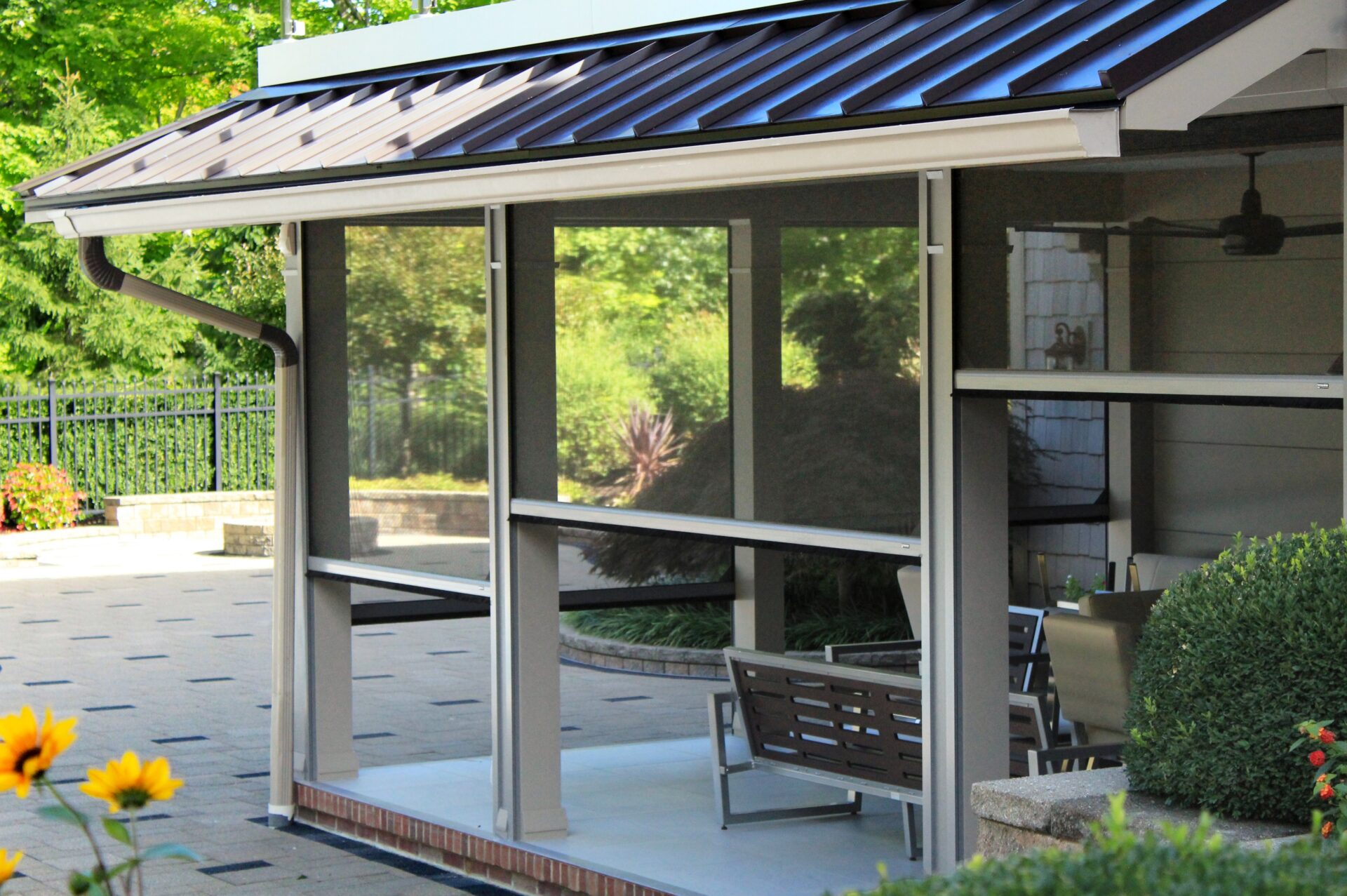 Screening Solutions Ohio transforms this outdoor patio into a screened-in porch in seconds by using Phantom Retractable Screens. These motorized screens appear at the touch of a button and retract out of sight when not in use.