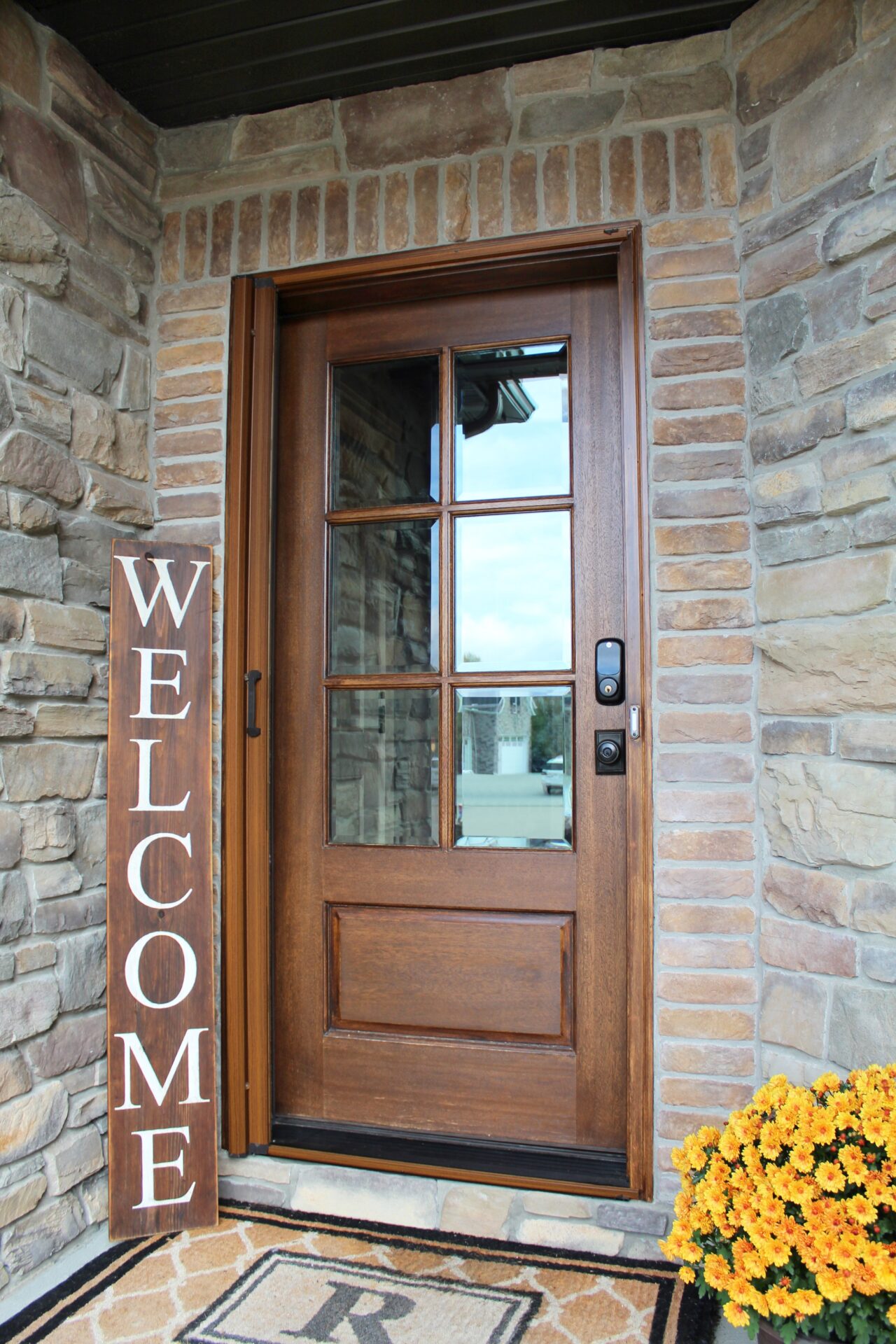 Screening Solutions Ohio uses a Phantom Retractable Screen Door on a wood front door.
