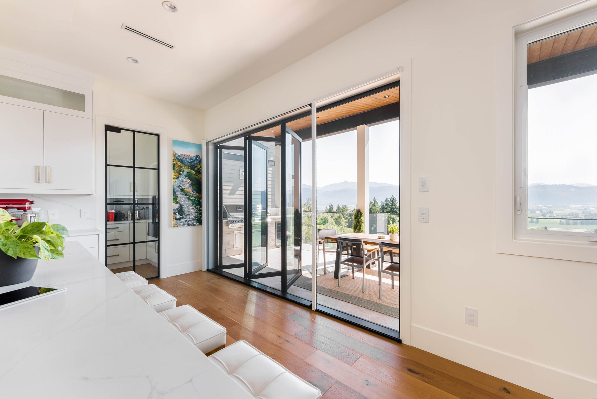 Phantom Retractable XL Screen mounts to a bi-fold door opening and lets fresh air in to the home.
