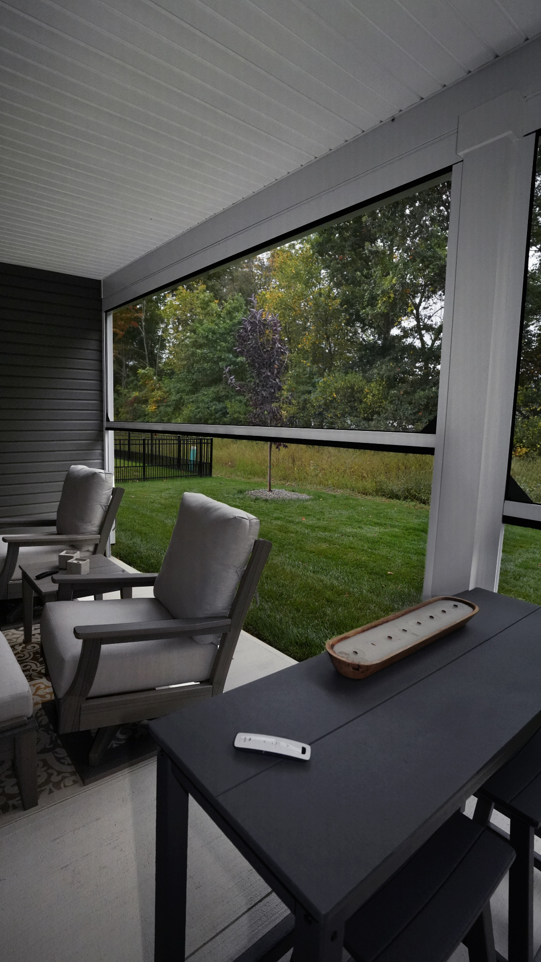 Christmyer Photo 10 The Screening Solutions installation team took this open covered patio in Avon Lake, Ohio and by adding three Phantom Motorized Retractable Screens to the patio’s openings, it’s now a bug-free and breezy outdoor sanctuary. The screens use an insect mesh to keep out bugs while still allowing fresh air to cool down the space and preserve the view out.