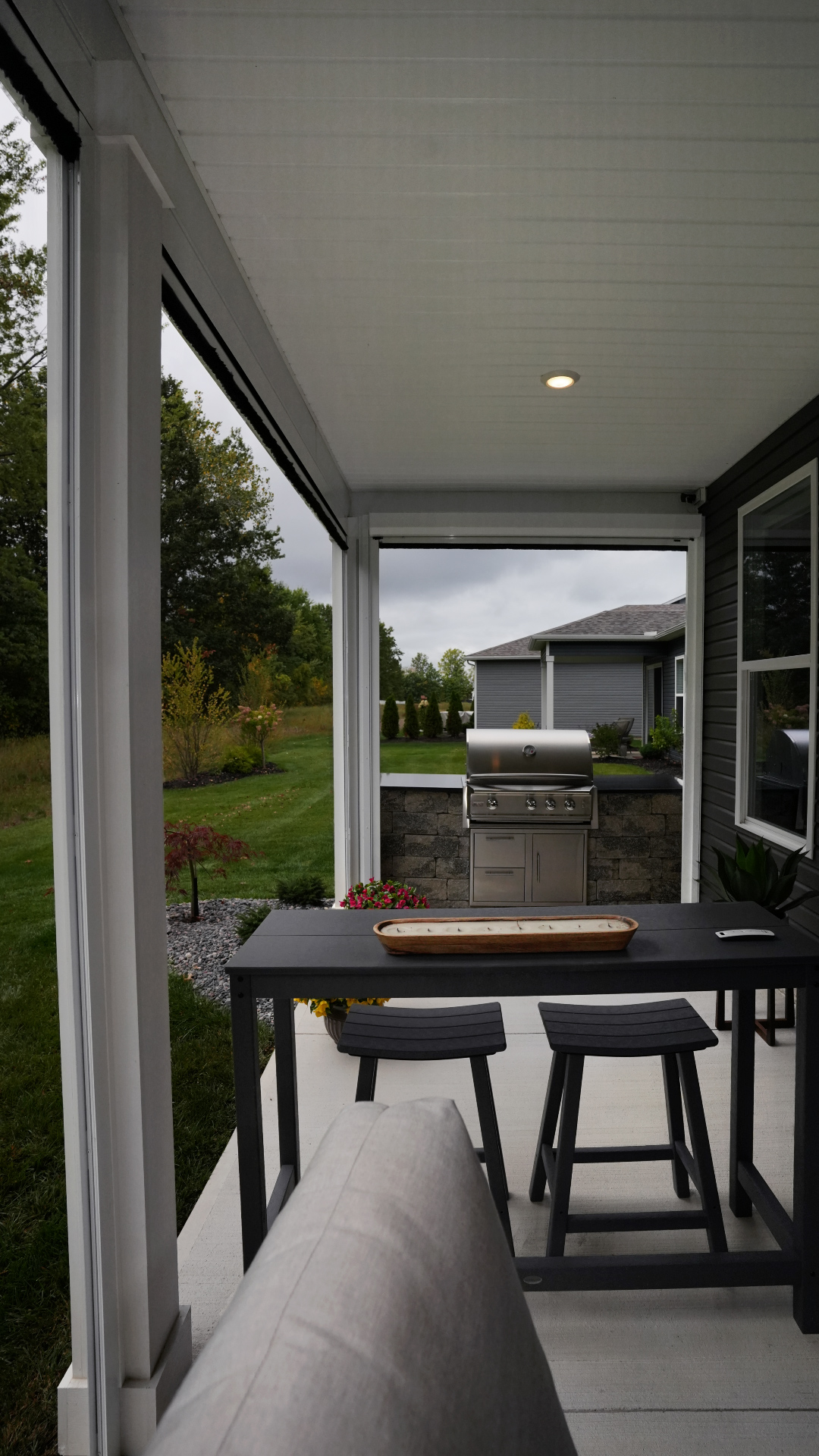 Christmyer Photo 12 The Screening Solutions installation team took this open covered patio in Avon Lake, Ohio and by adding three Phantom Motorized Retractable Screens to the patio’s openings, it’s now a bug-free and breezy outdoor sanctuary. The screens use an insect mesh to keep out bugs while still allowing fresh air to cool down the space and preserve the view out.