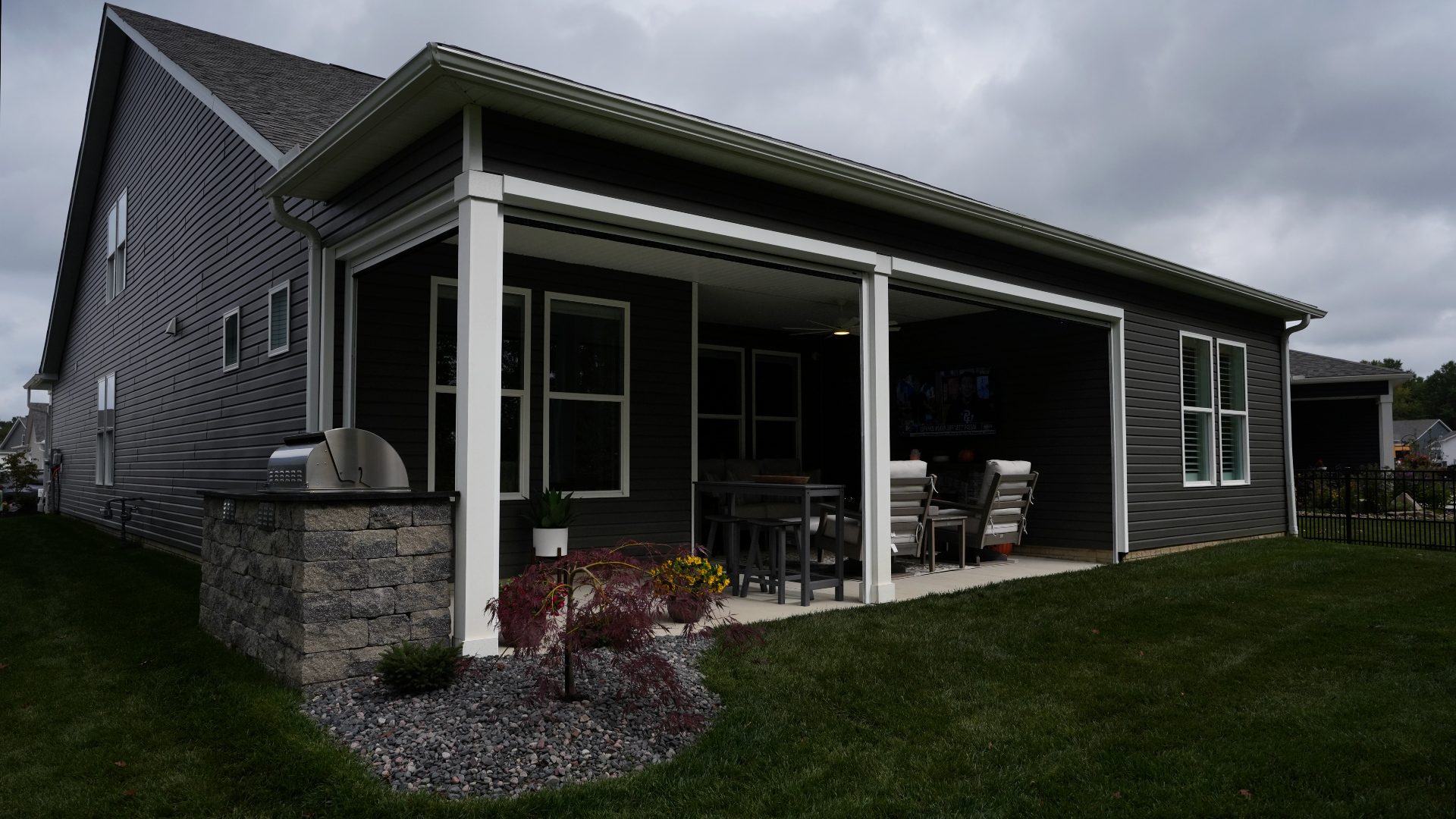 Christmyer Photo 2 The Screening Solutions installation team took this open covered patio in Avon Lake, Ohio and by adding three Phantom Motorized Retractable Screens to the patio’s openings, it’s now a bug-free and breezy outdoor sanctuary. The screens use an insect mesh to keep out bugs while still allowing fresh air to cool down the space and preserve the view out.