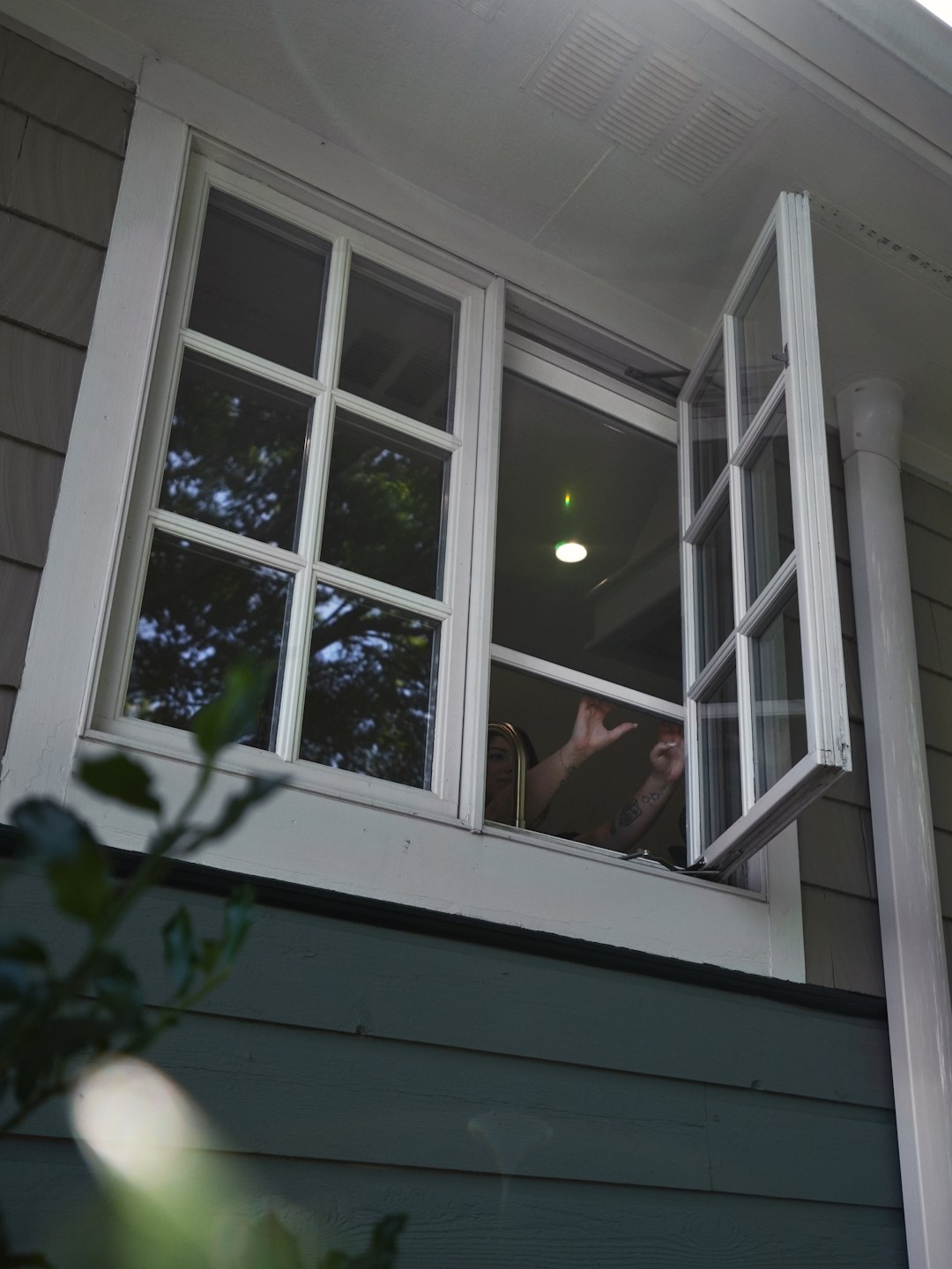 Brady Photo 14 Ohio homeowner pulls down the Phantom Retractable Window Screen.